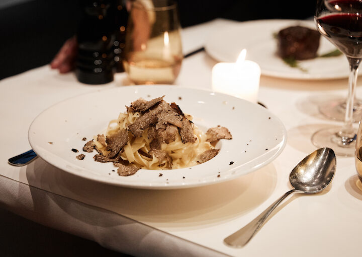 The George Hotel Hamburg Restaurant Dacaio 45 People DaCaio restaurant table set with tagliatelle and truffle