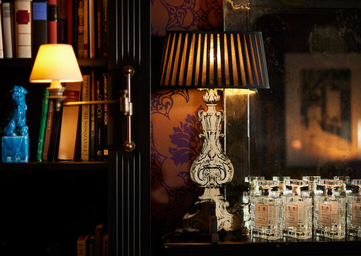 Elegant lamp with wide shade on the fireplace mantle