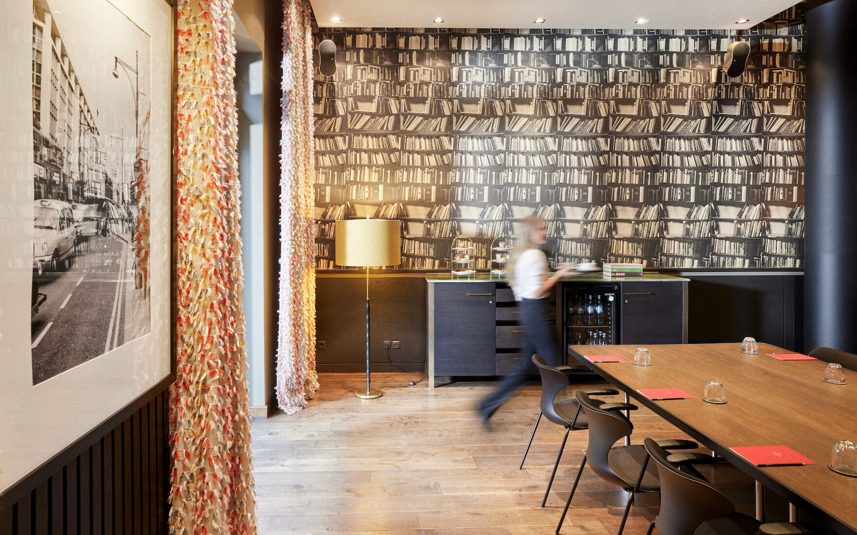 Clubroom M shown with service staff preparing the space