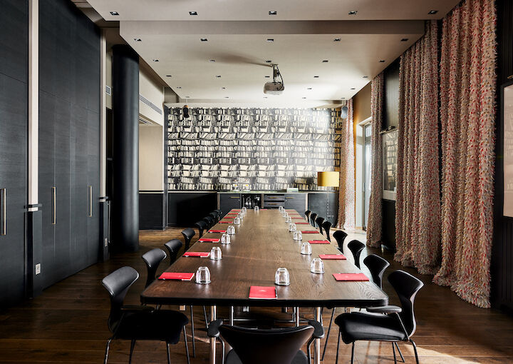 Clubroom XL set up with a large table for 18 attendees