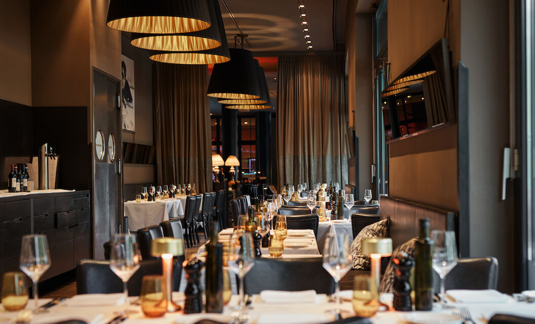 Close-up of beautifully set dinner tables in soft light