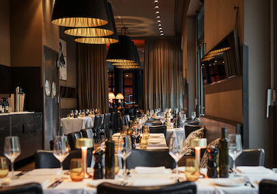 Close-up of beautifully set dinner tables in soft light