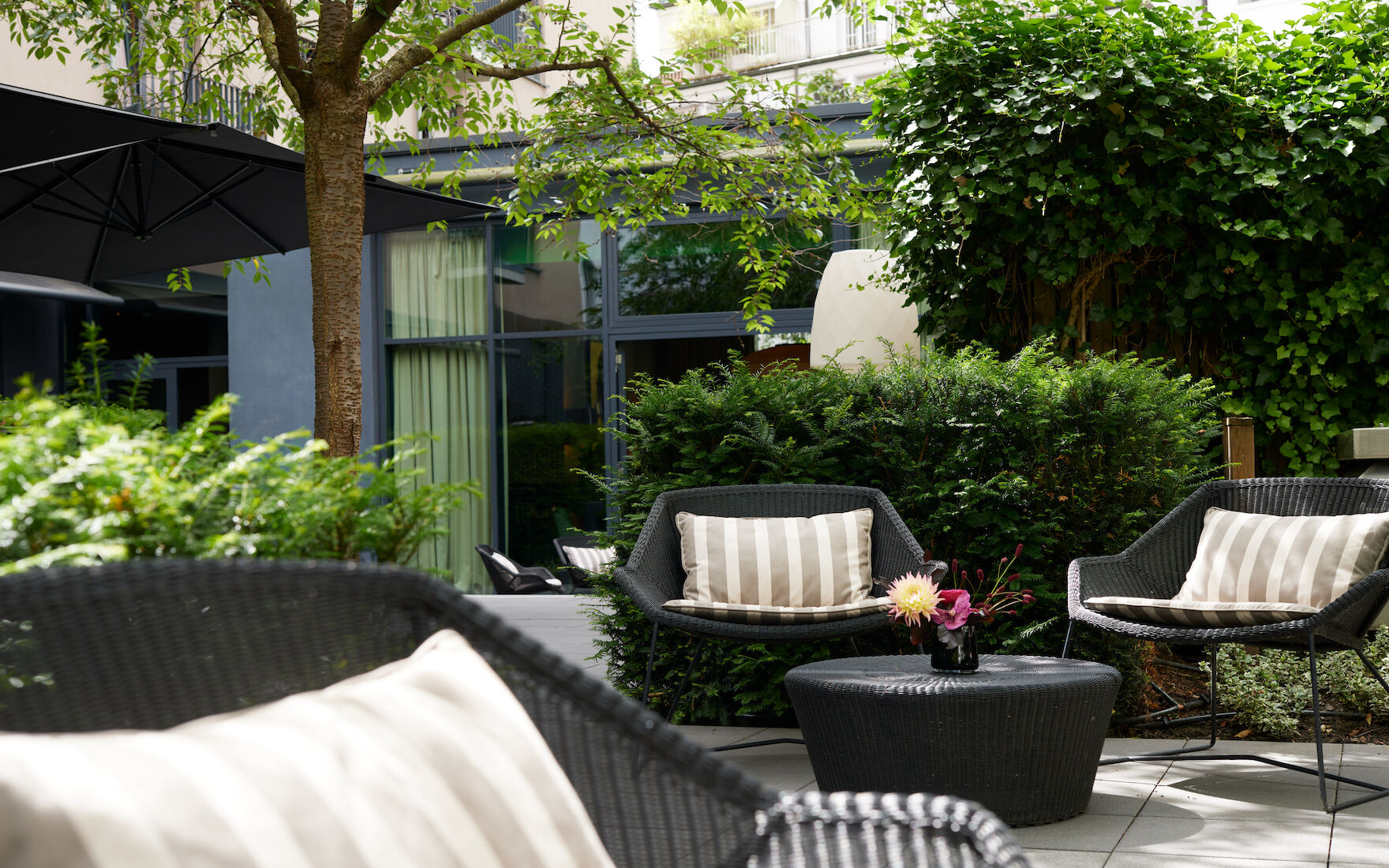 Cosy outdoor seating area at the George Garden
