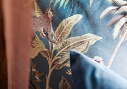 The George Hotel Hamburg Zimmer S Room 011 Close-up of a cushion featuring plants and monkeys