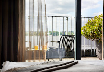 View from balcony with furniture towards the Outer Alster